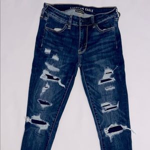 Distressed blue skinny jeans